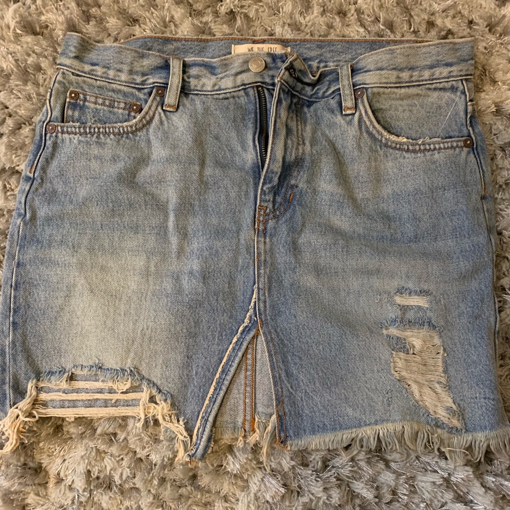 Distressed denim skirt.